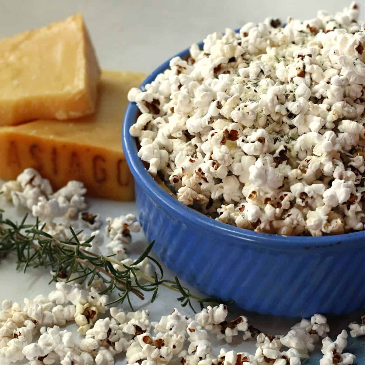 A blue bowl filled with popcorn.