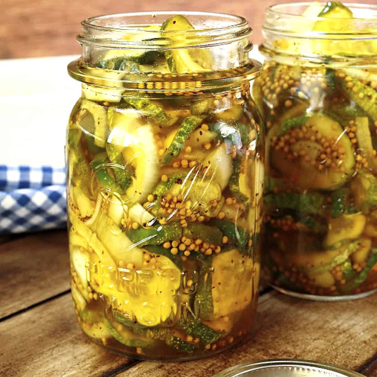 Refrigerator bread and butter pickles in jars.