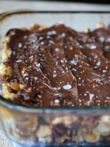 A baking pan with chocolate topped caramel corn.