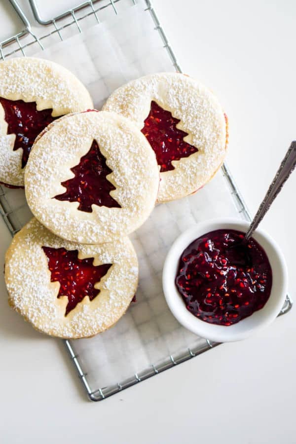 Raspberry Linzer cookies with a Christmas tree cutout