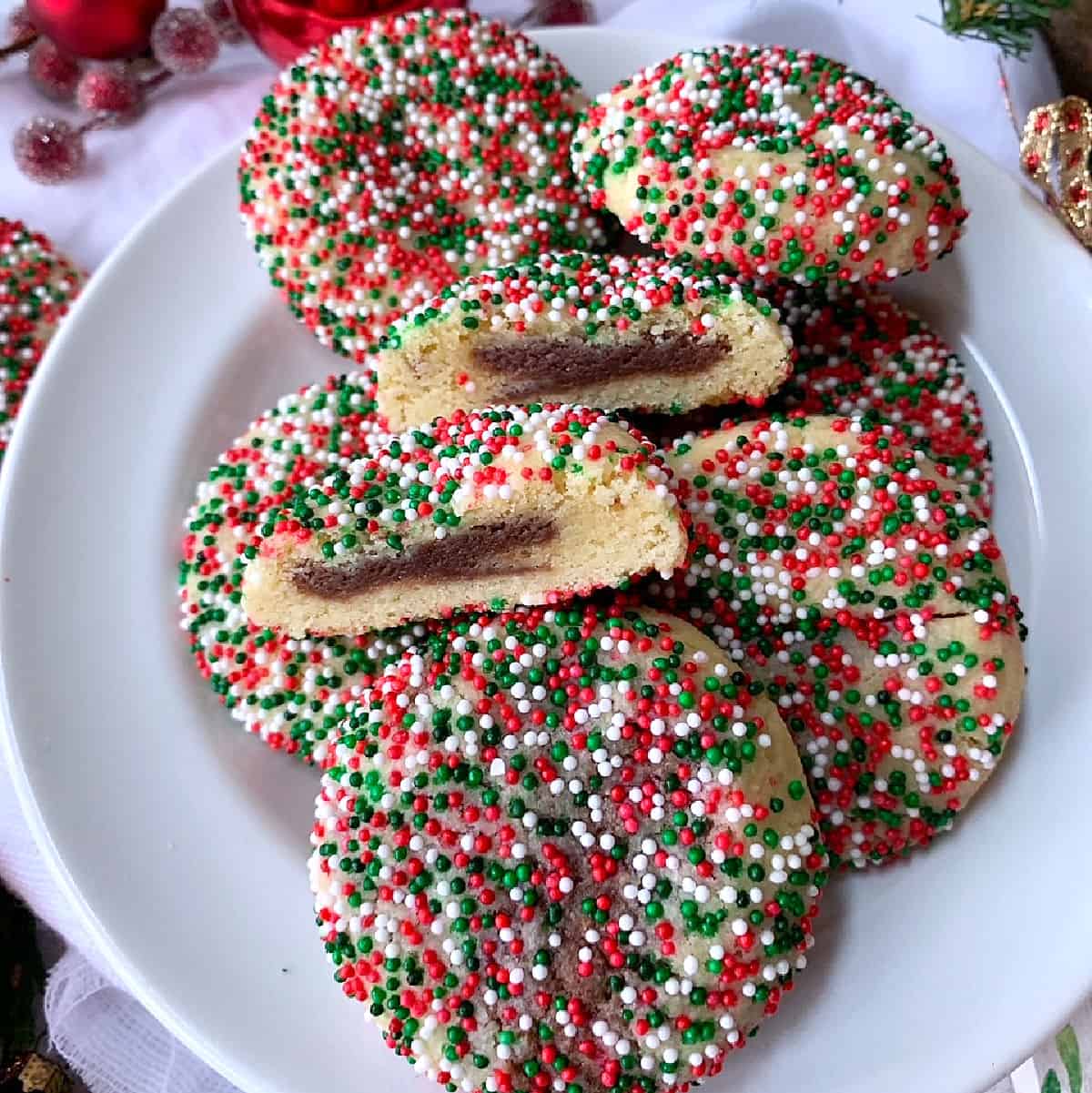 A white plate with Christmas sprinkle cookies