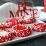 A white tray with sprinkle thumbprint cookies