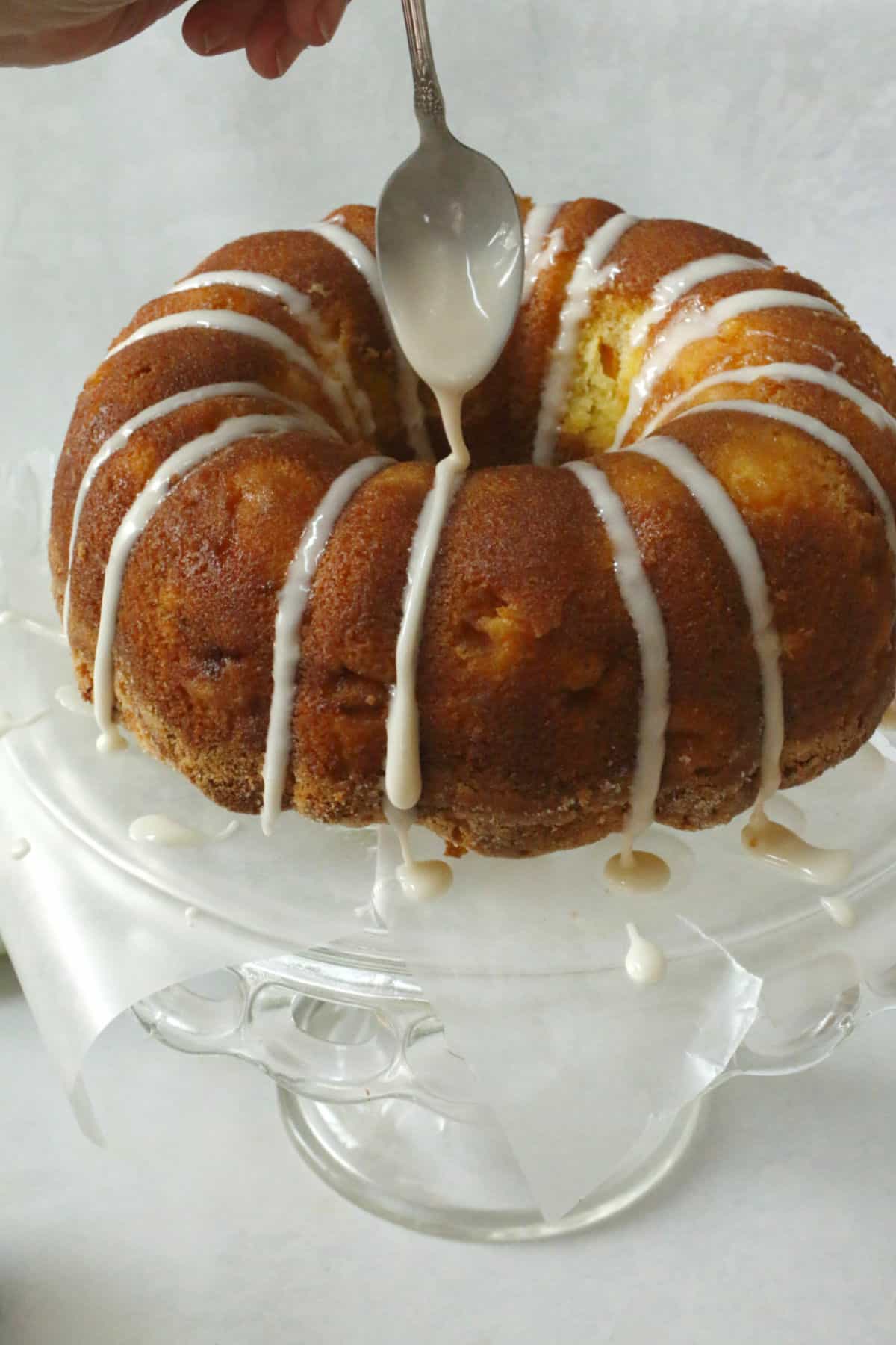 Drizzling icing on a bundt cake.