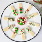Christmas wafer cookies on a white plate.