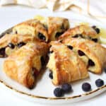 Blueberry scones on a white plate.