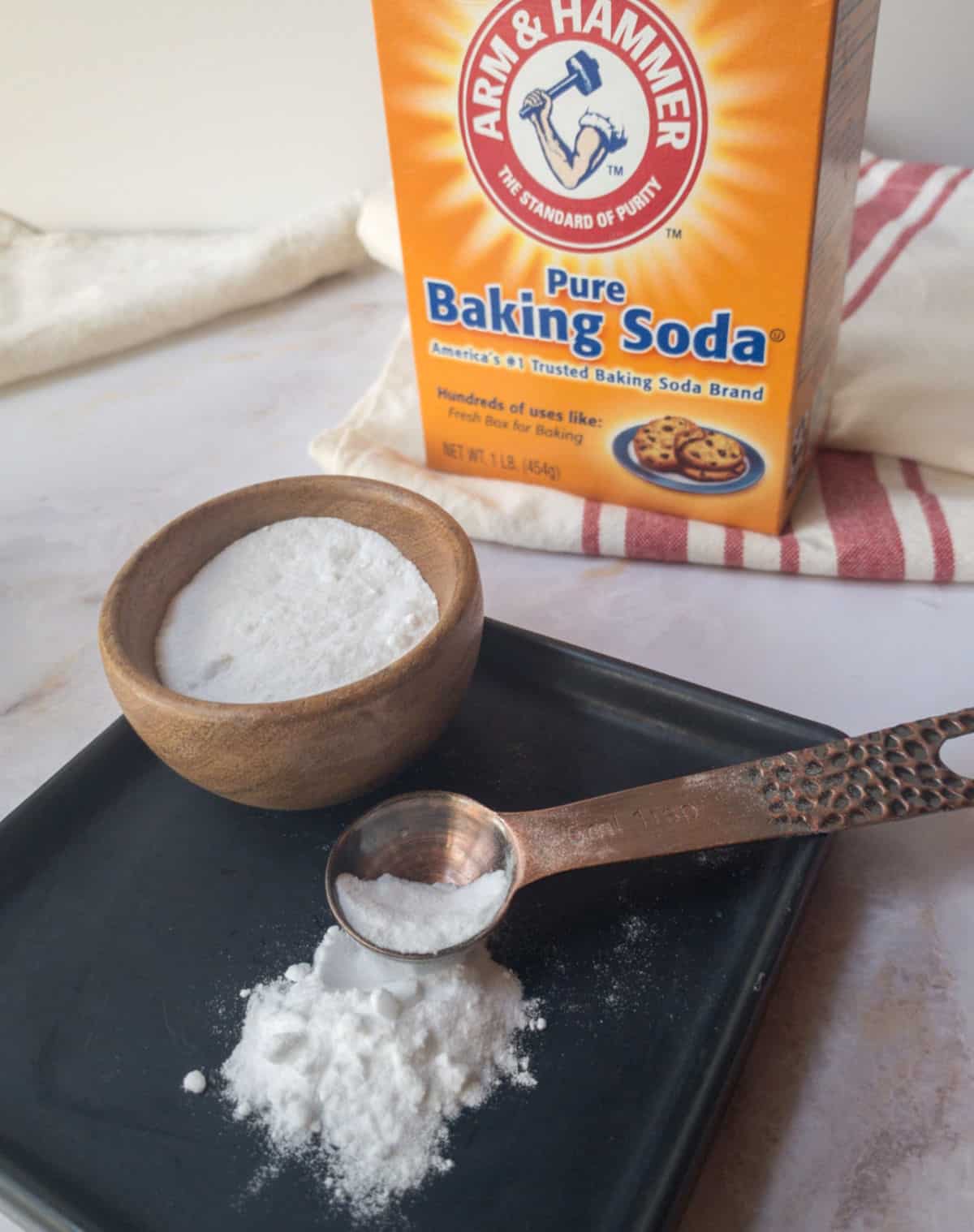 An Arm and Hammer box of baking soda.