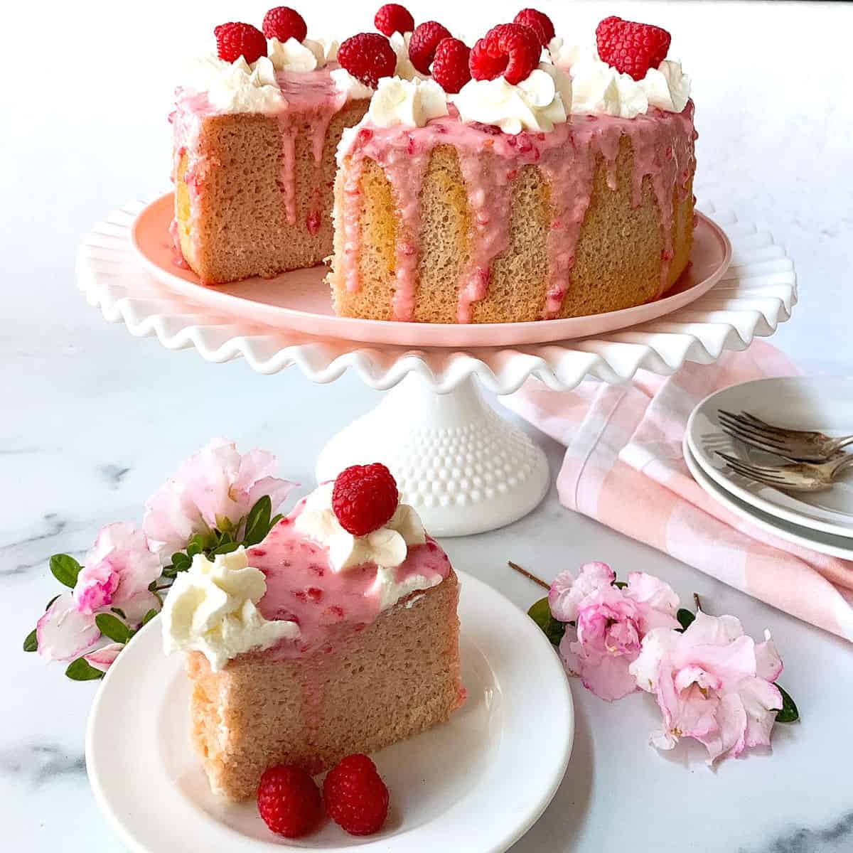 Raspberry Chiffon Cake on a white cake stand.