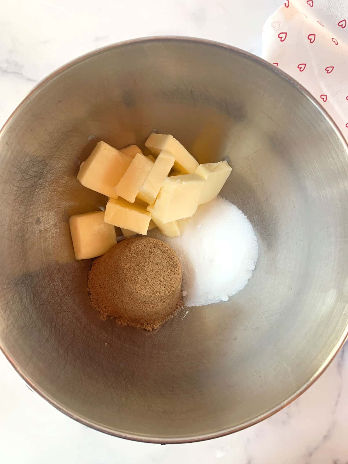 Mixing bowl with butter and sugar.
