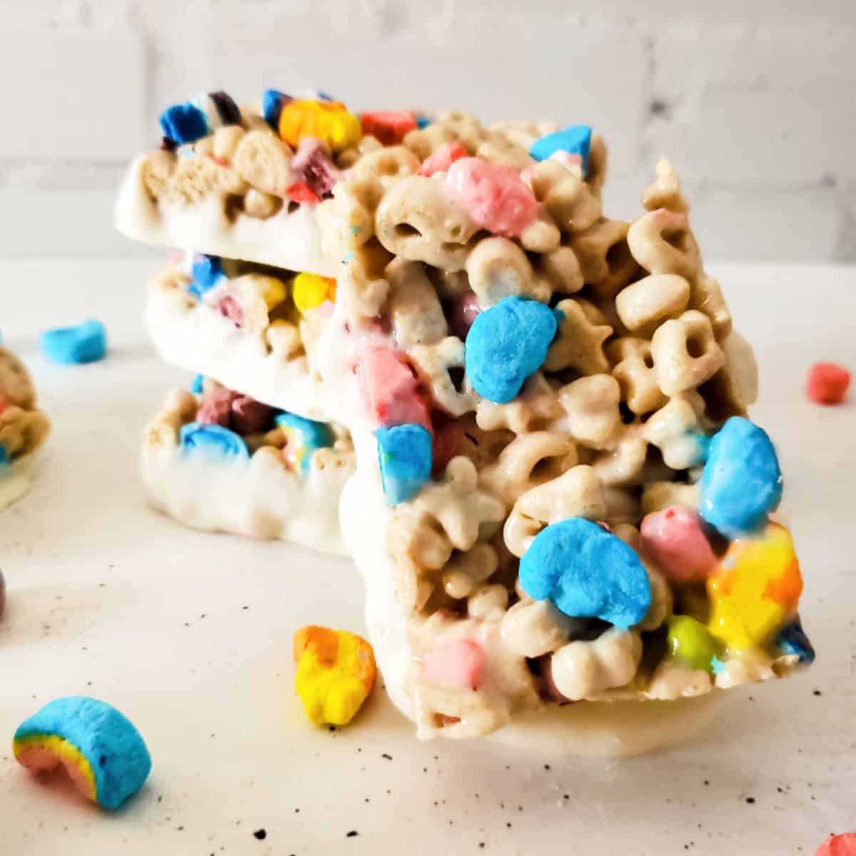 Rice krispie bars made with Lucky Charms cereal.