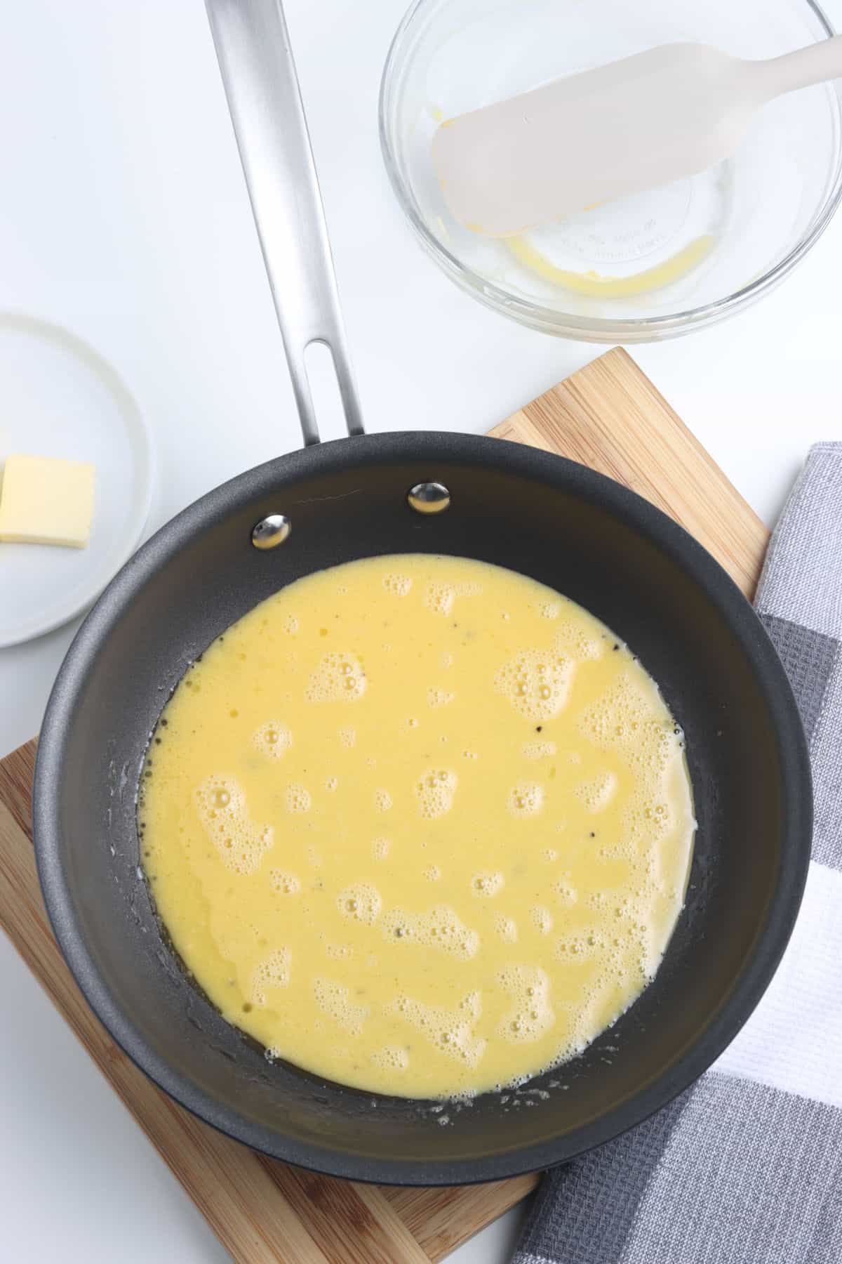 Cooking eggs in a frying pan.