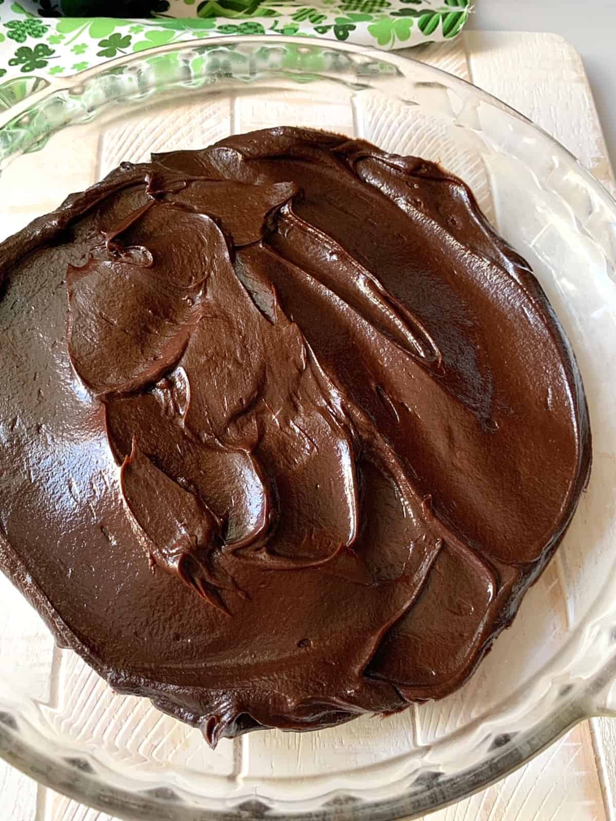 Chocolate ganache in a clear pie plate.