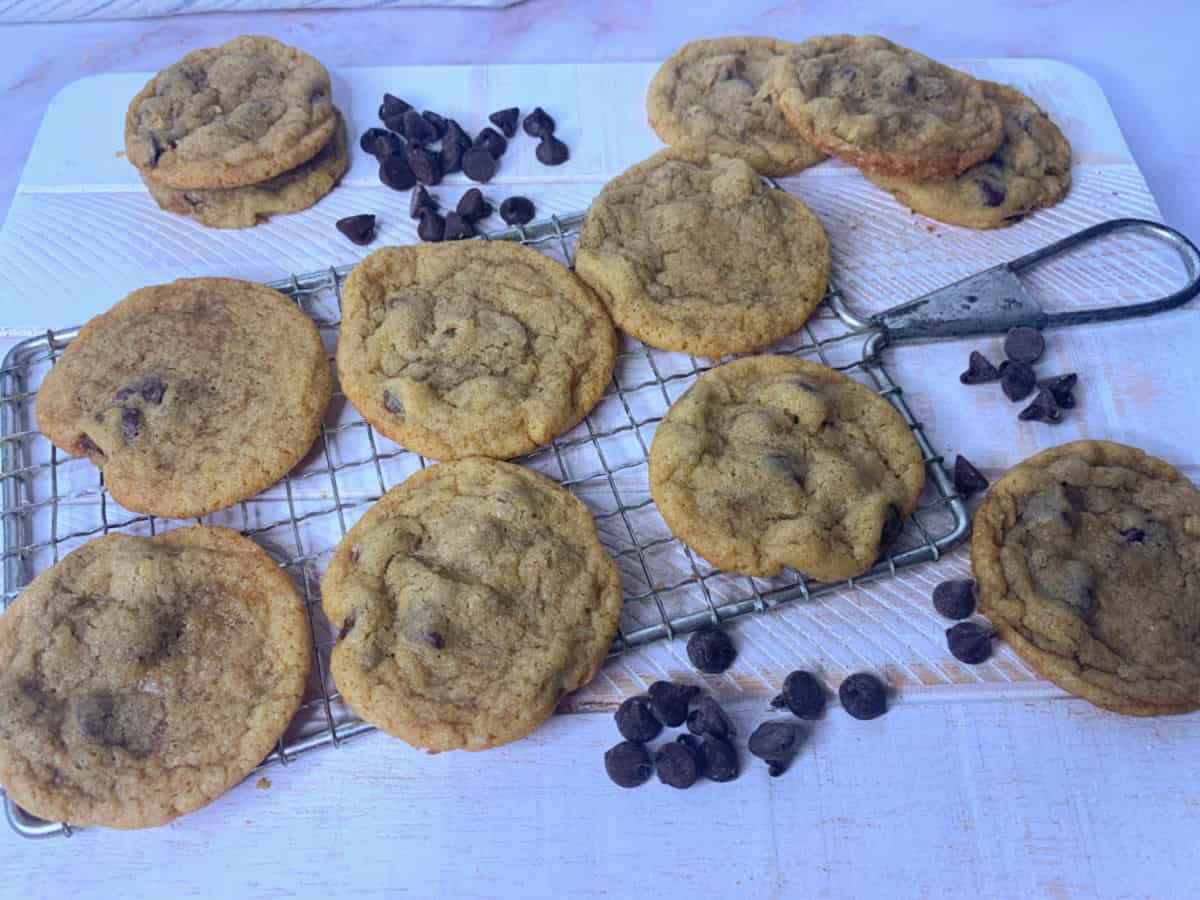 Chocolate chip cookies on a wire cooling rack.