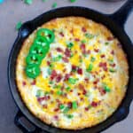 A skillet filled with an a cheese dip.