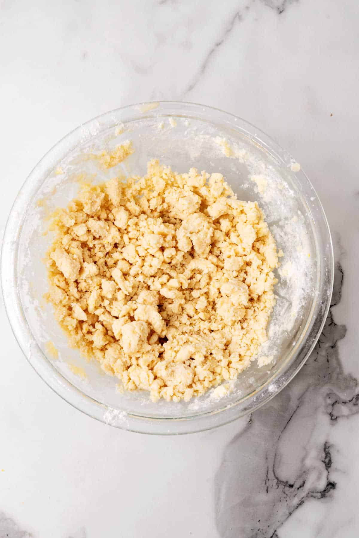 Shortbread cookie dough in a glass bowl.