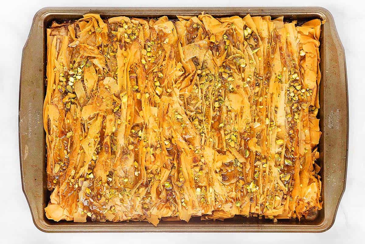 Overhead view of a crinkled dessert with pastry.
