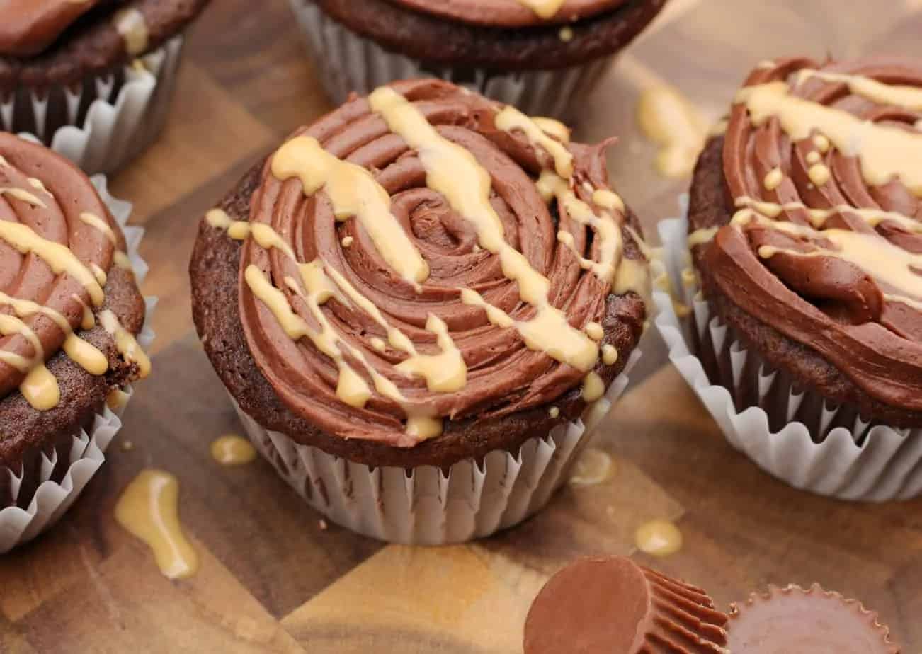 Cupcakes on a cutting board.