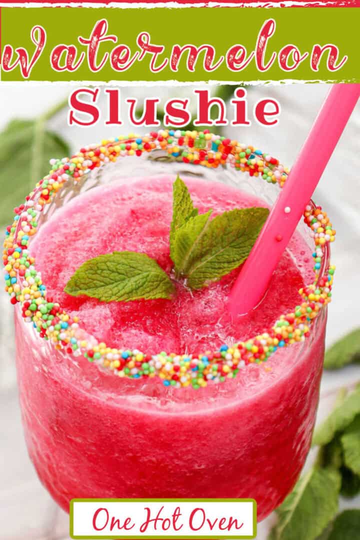 A watermelon slushie in a glass rimmed with colorful sprinkles, garnished with mint leaves and served with a pink straw.