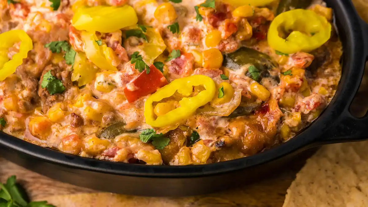 A taco inspired chunky dip in a bowl.