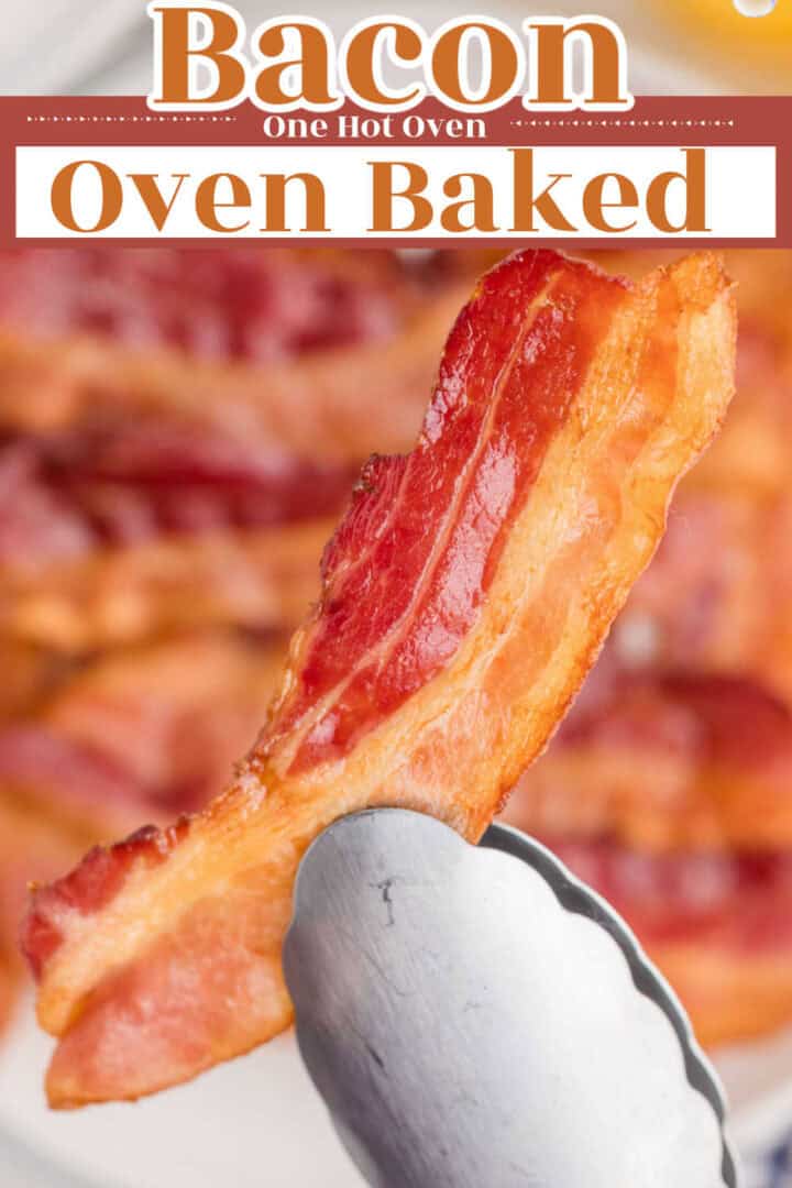 A piece of crispy bacon held by metal tongs, with more bacon pieces blurred in the background. Text reads "Bacon One Hot Oven Oven Baked.