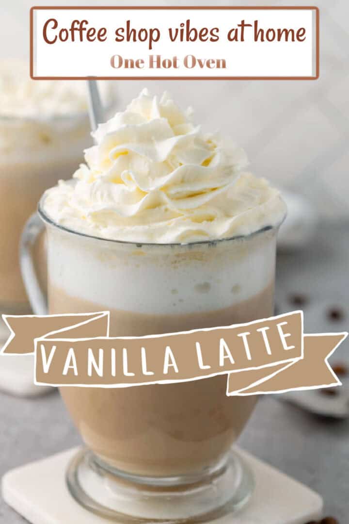 A glass mug of vanilla latte topped with whipped cream sits on a table, with another latte blurred in the background. Text on image reads "Vanilla Latte" and "Coffee shop vibes at home.
