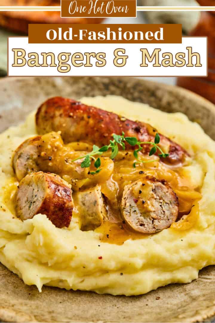 A plate of mashed potatoes topped with sliced sausage, brown gravy, and a sprig of fresh herbs. Text overlay reads "Old-Fashioned Bangers & Mash.